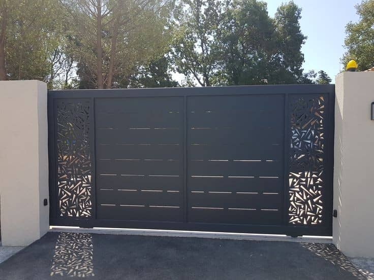 Black gate with intricate laser-cut botanical side panels